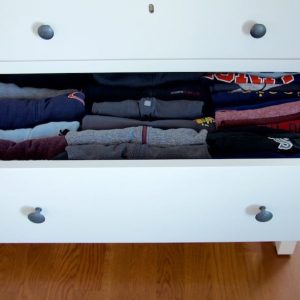 A dresser drawer filled with shirts folded vertically. #folding