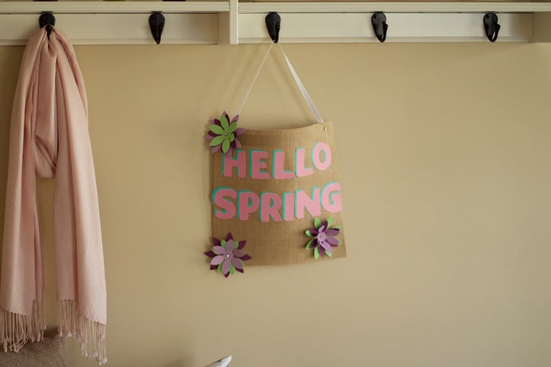 No-Sew "Hello Spring" Burlap Wall Hanging hanging on coat rack. #nosewwallhanging