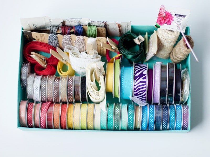 Box full of colored ribbons and strings #ribbonstorage