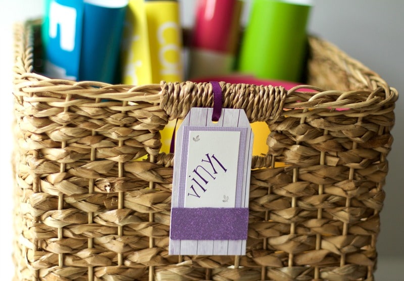 Woven basket labeled and filled with vinyl #organize #craftsupplies