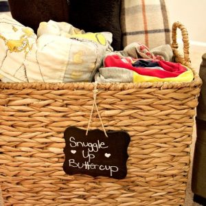 Basket filled with blankets and chalk label: "Snuggle Up Buttercup" #blankets