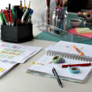 Open planner, pens, washi tape and other materials to get organized #planner