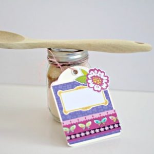Cookie mixture in a jar with tag and wooden spoon #cookie #hostessgift