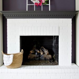 Learn the best way to transform your space by creating white brick fireplaces. Using Sherwin Williams paint and primer, you can easily paint a fireplace in a weekend. Just follow these tips and you are ready to give your room a new look! #whitebrick #fireplace #farmhouse