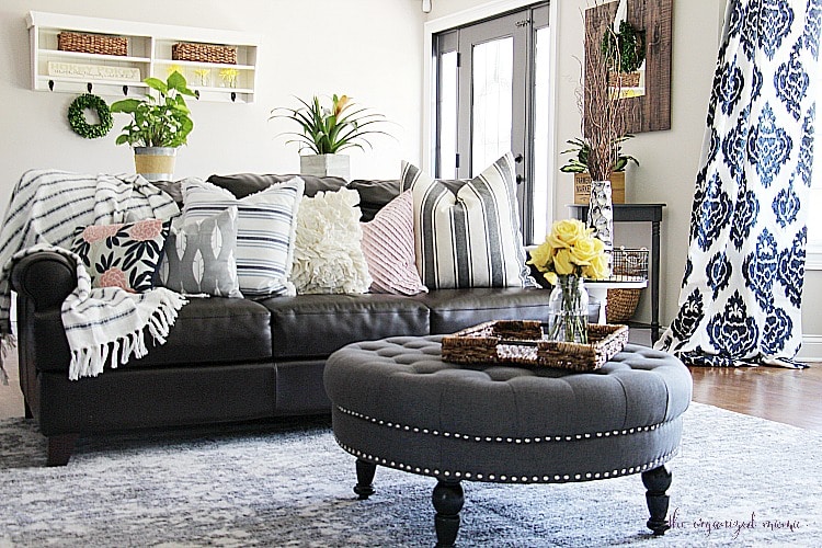 Check out inspiration for creating a modern farmhouse living room. With product links and tips for painting a fireplace, swapping out electrical outlets, and styling the room on a budget, you'll be able to set up your living room easily! #modernfarmhouse #livingroom #orc