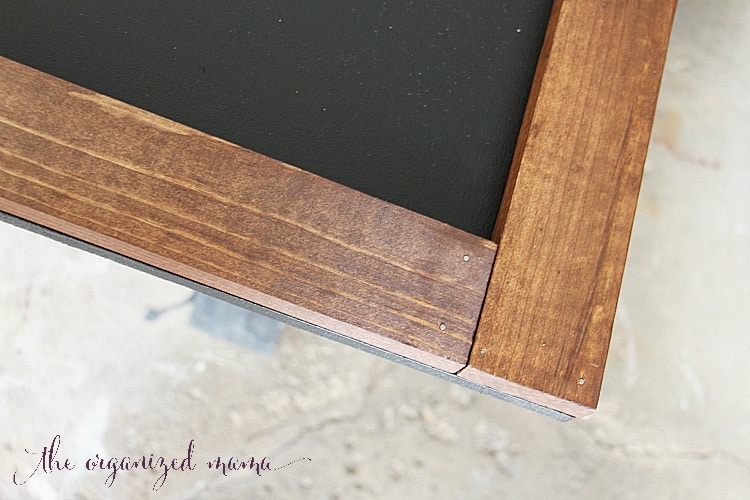 Attach the wood to the MDF using finishing nails to the simple extra large chalkboard