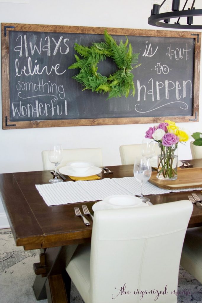 simple extra large chalkboard in dining room with quote and table setting