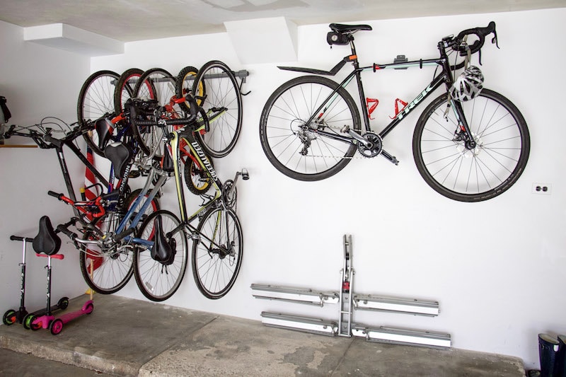 Professional Organizer shares tips on how to utilize space to create garage bike storage that won't break the bank. Plus ideas for bike supply organization. #garageorganization #bikestorage