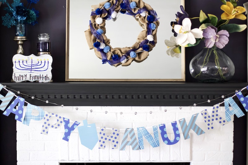 Learn how to create a happy Hanukkah rustic wood sign using Sharpie brush pens, Elmer's Glitter Glue, and a wooden sign from Michaels!