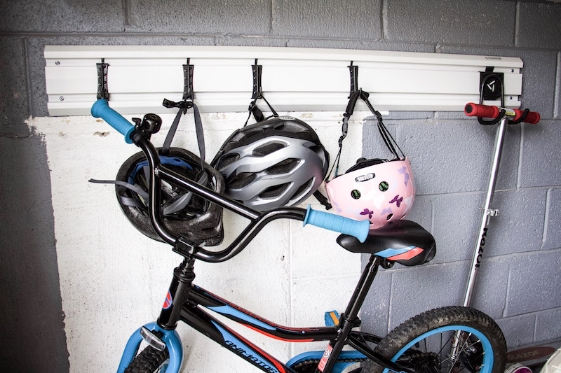 Professional Organizer shares tips on how to utilize space to create garage bike storage that won't break the bank. Plus ideas for bike supply organization. #garageorganization #bikestorage