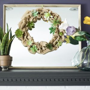 Follow this easy tutorial for creating dollar store flowers spring wreath! It makes the perfect addition to any space to add some spring into your home! #springwreath #flowers #dollarstore