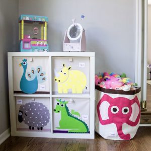 Playroom organization with 3 Sprouts bins in different animal prints in bright colored patterns to hold toys. #organized