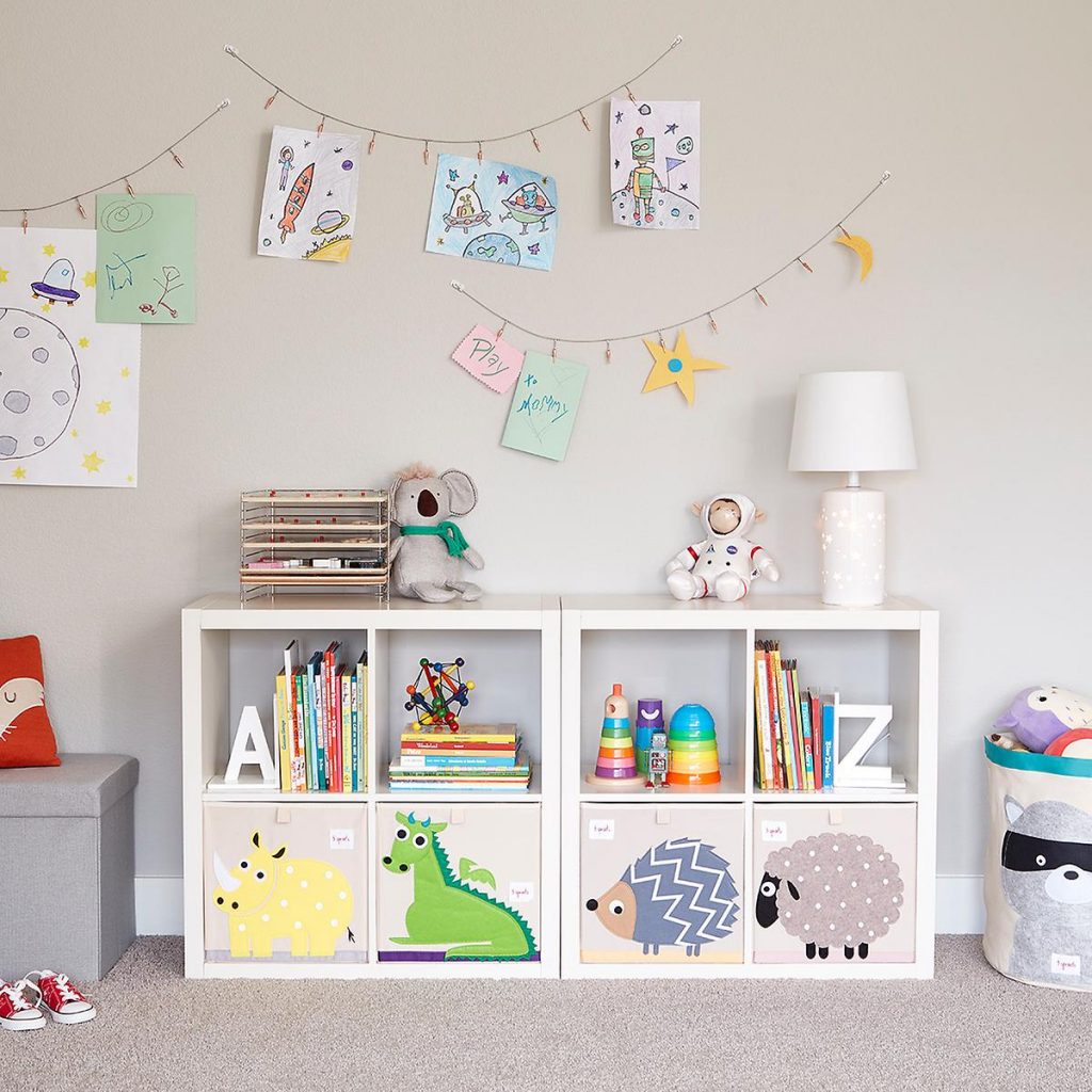 Playroom with cube organizers and wall decors in playroom #organized
