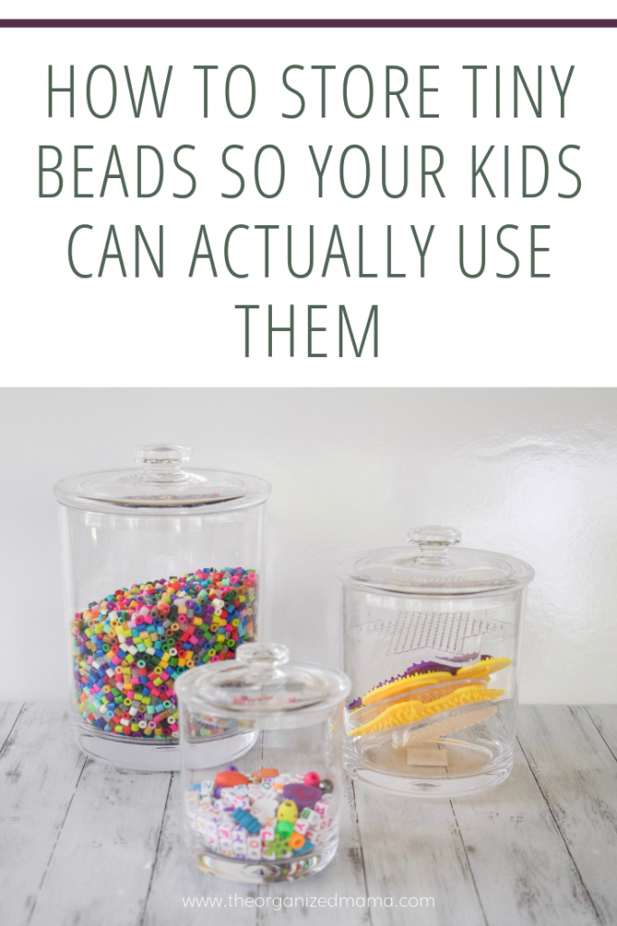 Acrylic jars holding small beads like pearler beads and pony beads with text overly that says how to store tiny beads so your kids can actually use them #kidsorganization
