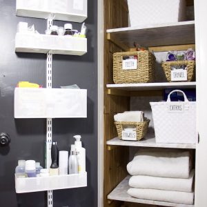 full shot of linen closet with items on door and items inside linen closet organized in bins with labels #linenclosets