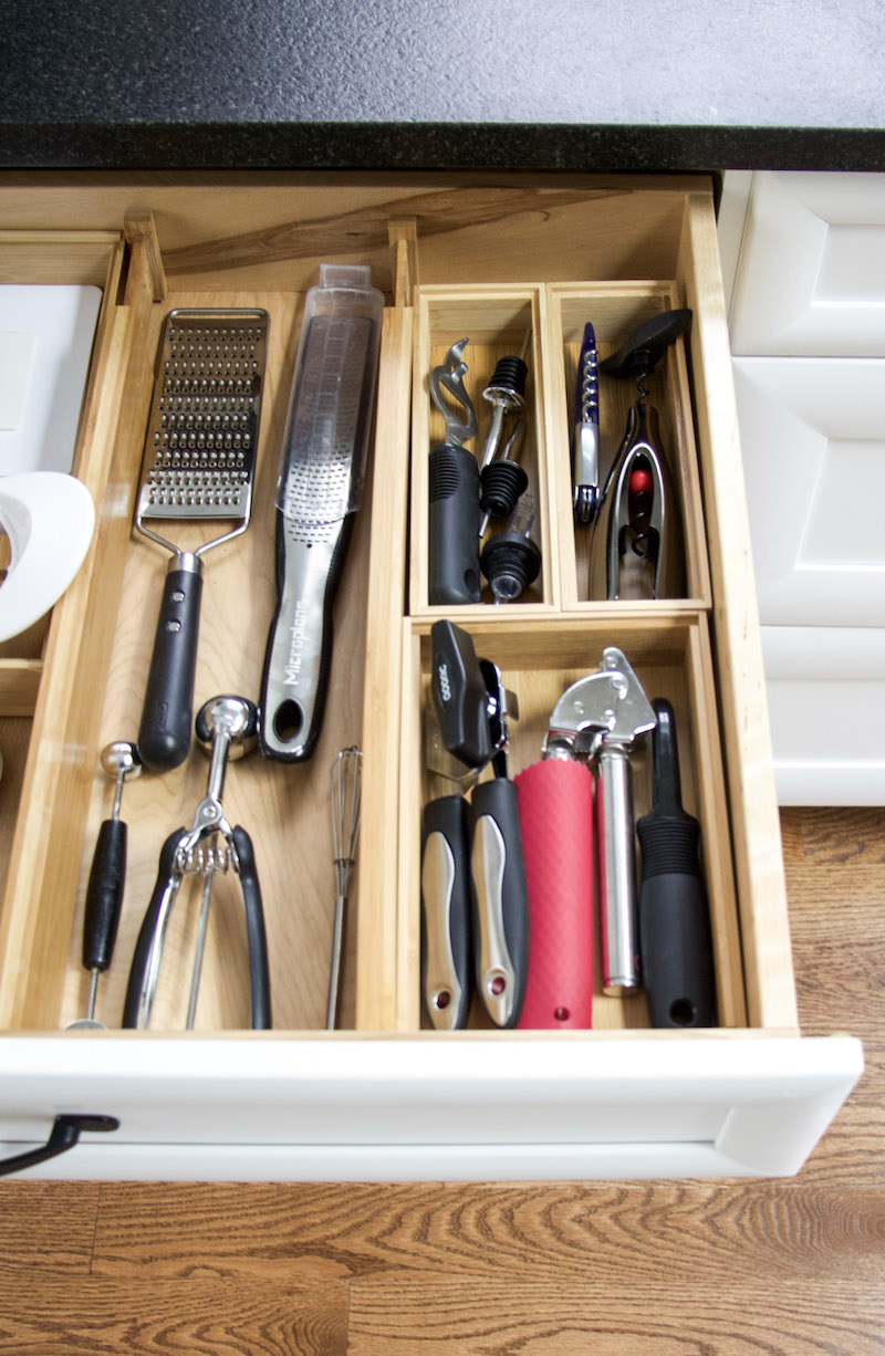 kitchen utensils organized in boxes and bamboo drawer dividers #sustainable #organized