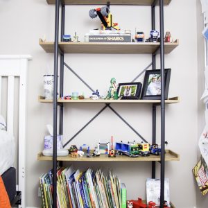 Kid's bookshelf with books stored on bottom shelf #organizedbooks #bookstorage