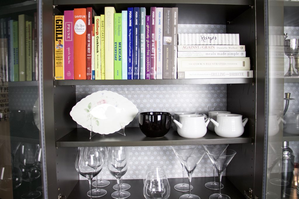 how to line cabinets with easyliner with cookbooks in front and glassware in front