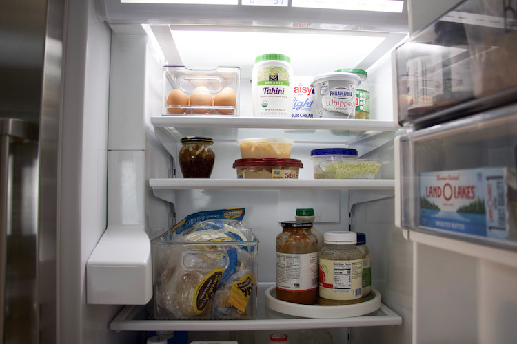 inside fridge with bins