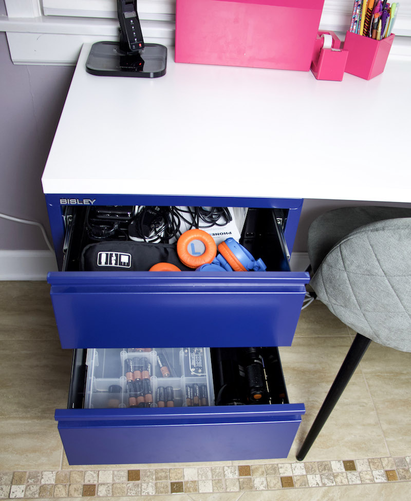desk drawer with batteries and electronic cords