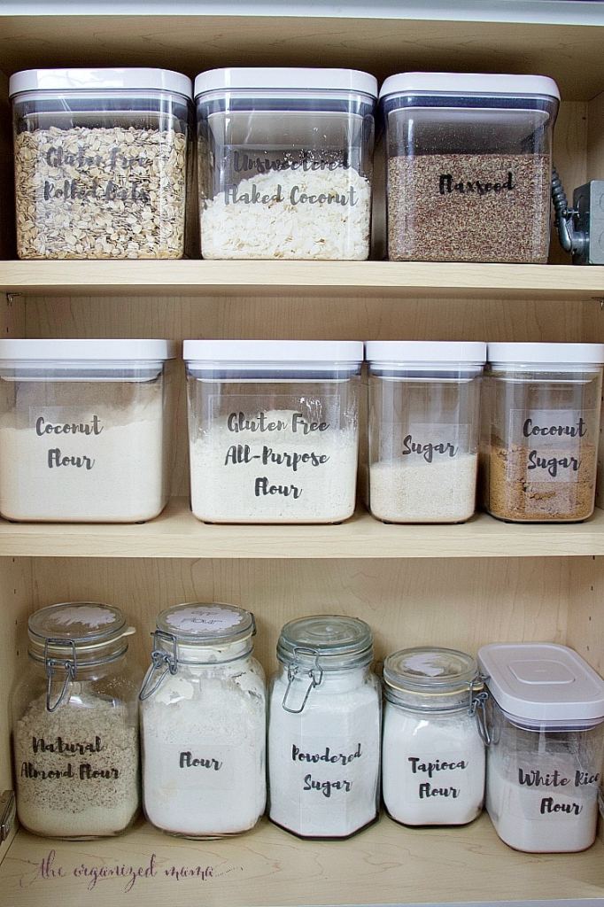 Baking supplies organized in clear containers with labels