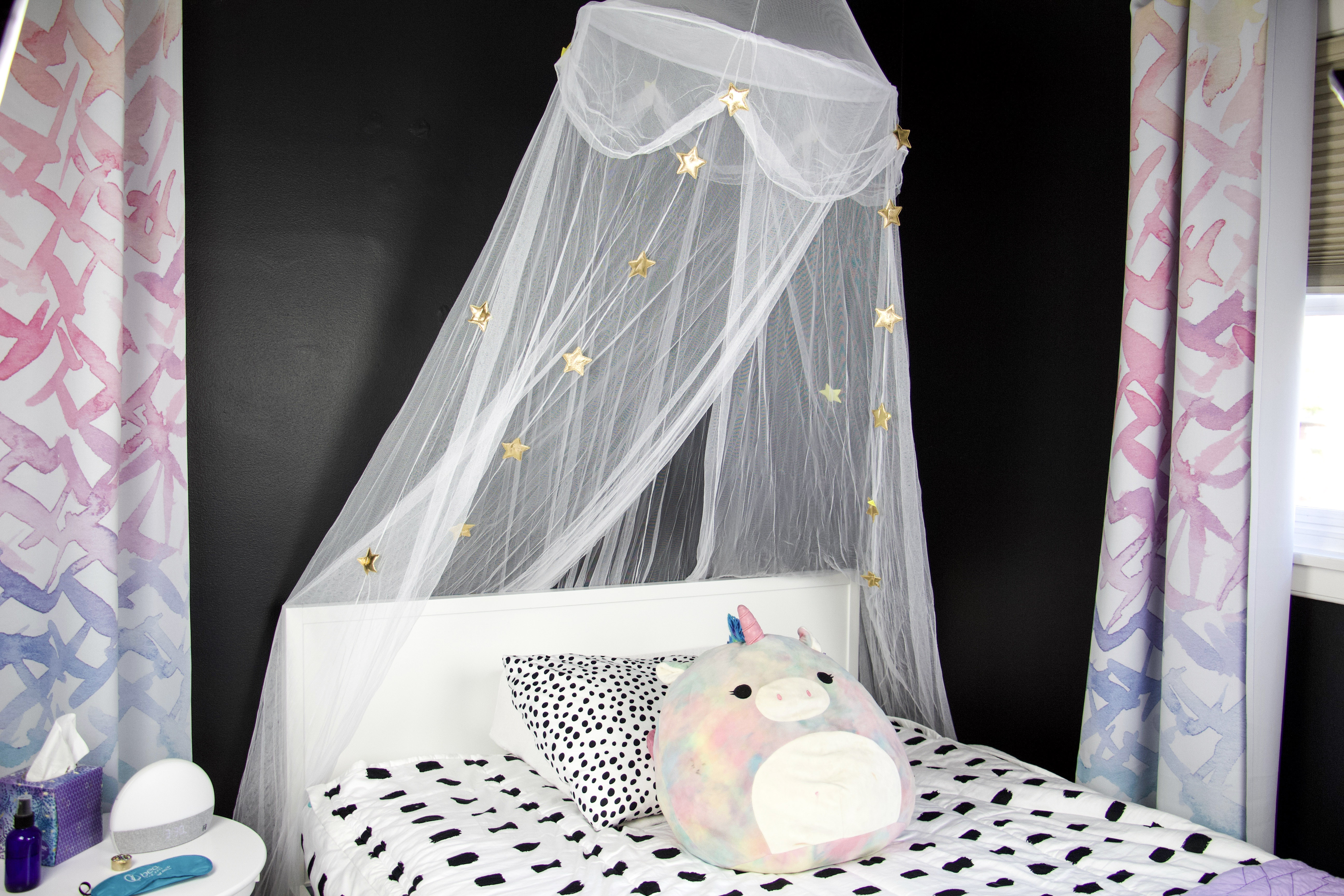 beddy's bedding, canopy over crate and kids bed against black wall
