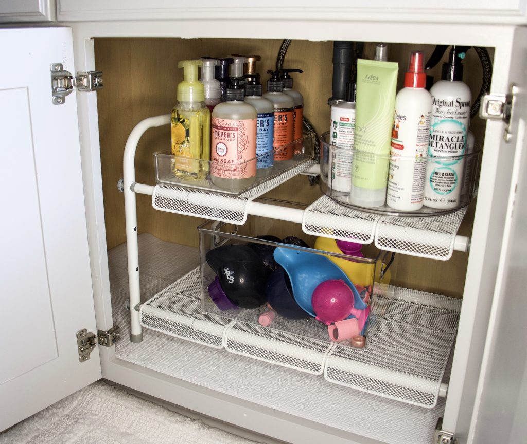 under sink expandable shelves with turntable and drawer organizers to keep things tidy
