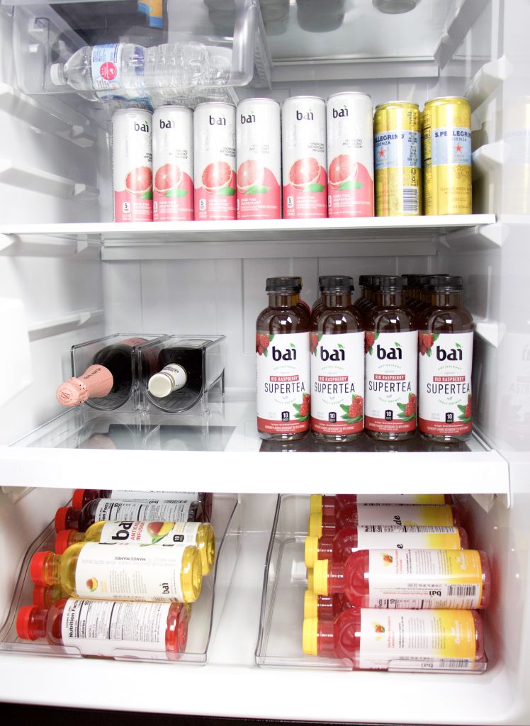 fridge with drinks lined in rows and organizers for wine