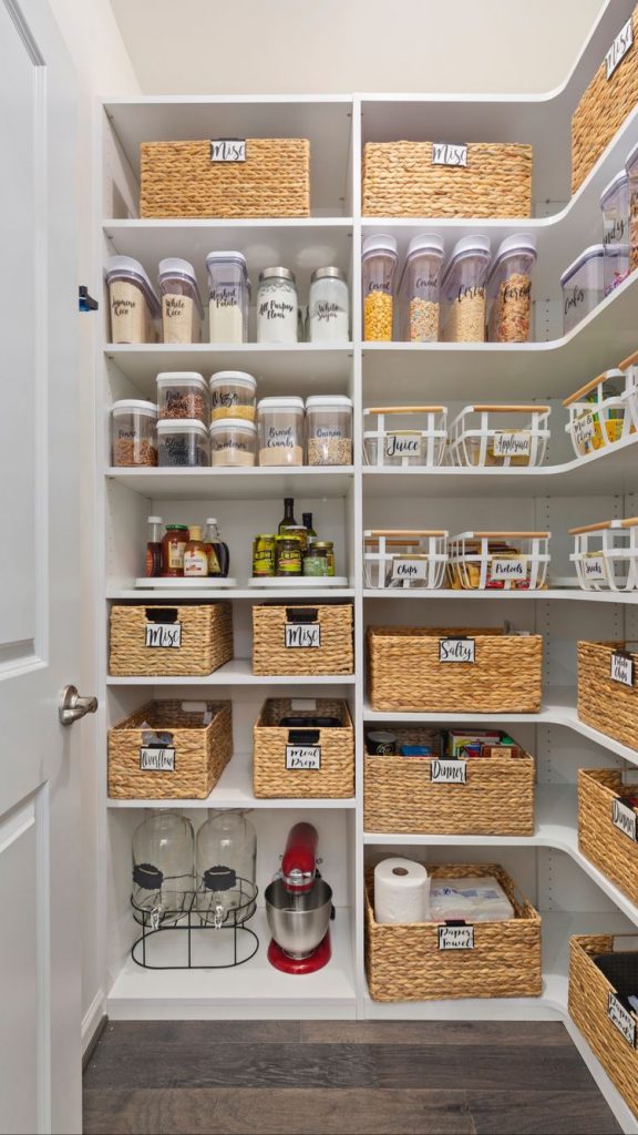 pantry with shelves and baskets and labels