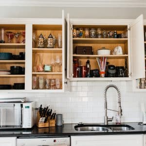 picture of kitchen cabinets with doors open and shelves beautifully organized