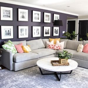 grey couch with cushions to demonstrate how to keep house clean