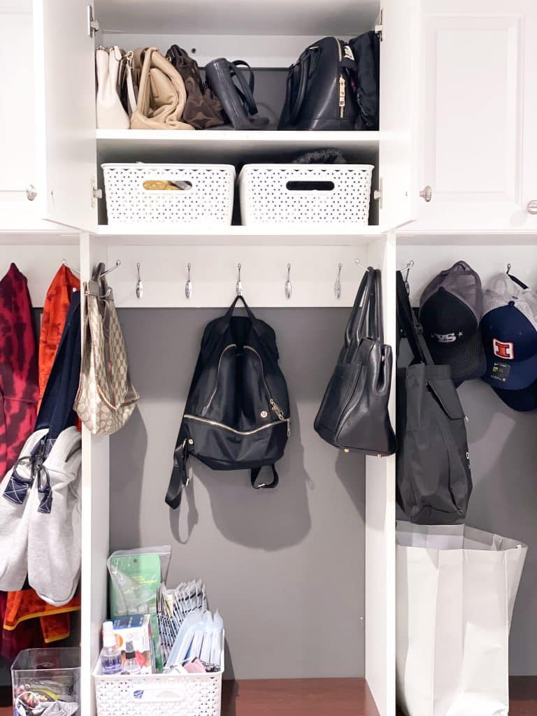 cubbie and cabinet for mudroom with bins and purses