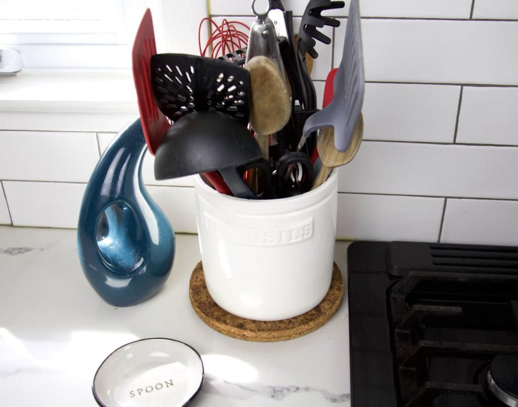 kitchen countertop with cooking utensils in canister