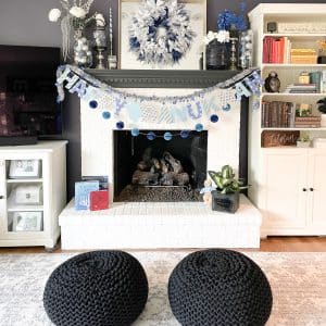 family room decorated for hanukkah with blue, silver and white decor