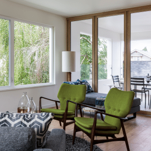 mid century modern living room with green chairs