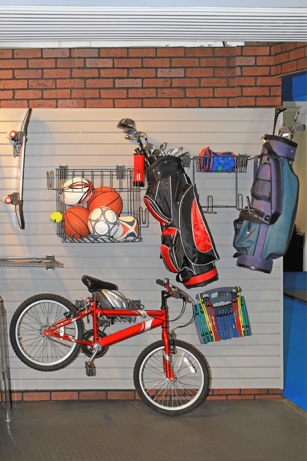 organized garage with items hanging on wall space
