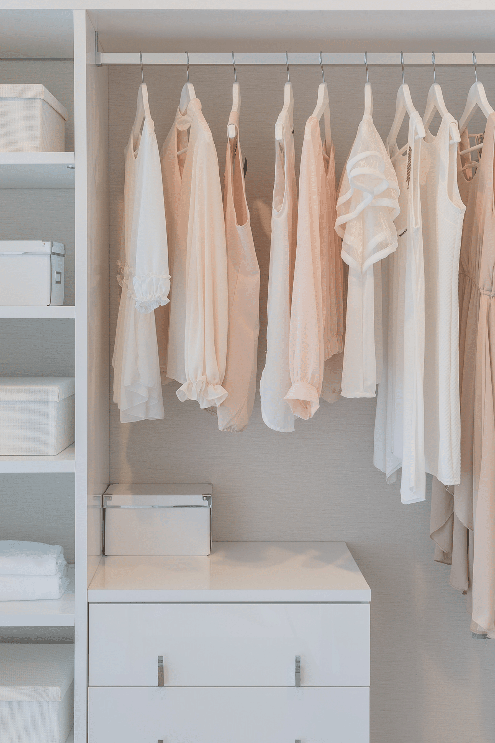 organizing clothing in walk-in closet