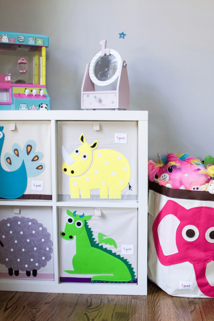 Organized bins in a kid's playroom to help with decluttering #toyorganization