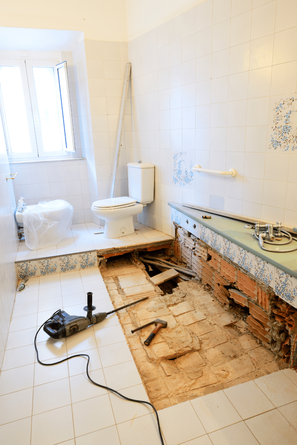bathroom remodel in process with flooring removed