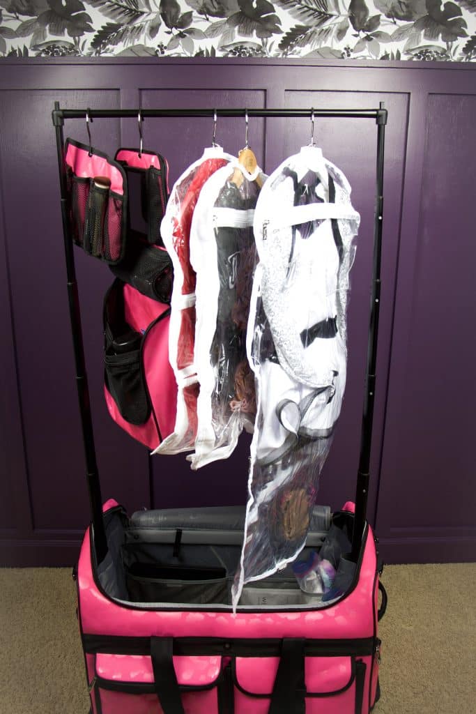 Pink Dream Duffel with rack and costumes hanging