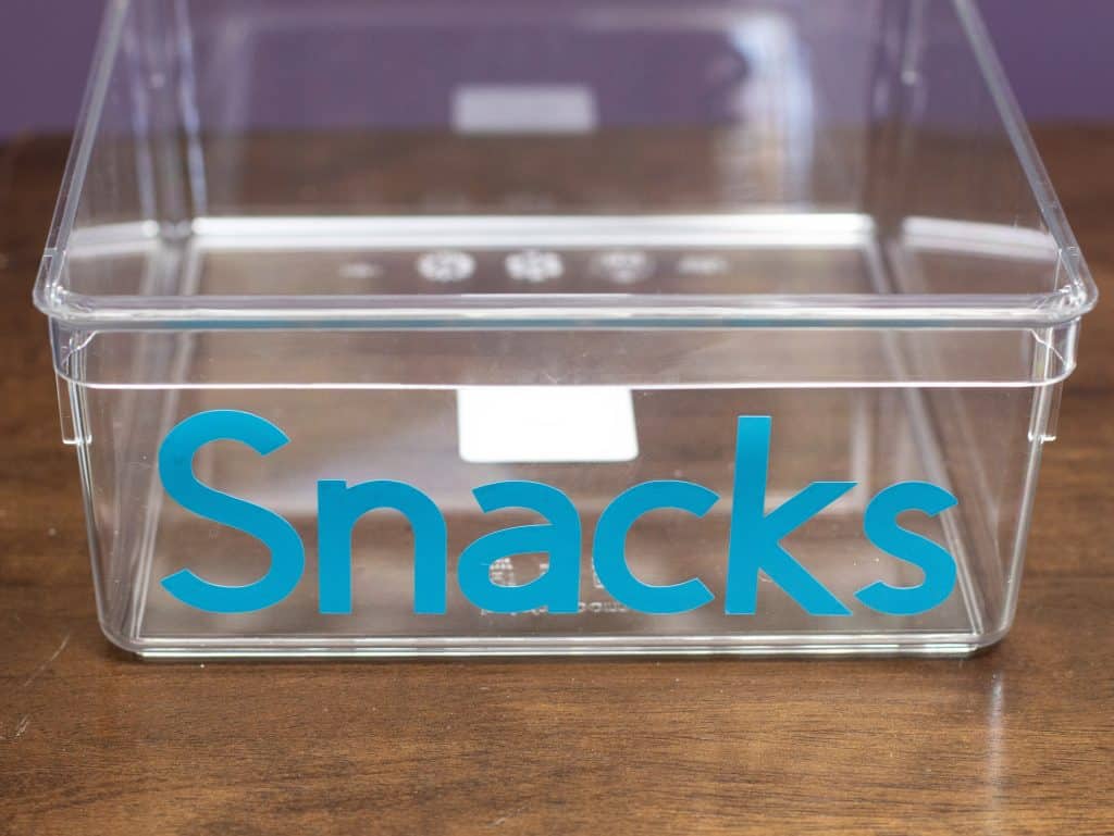 permanent smart vinyl adhered to snack bin using the cricut joy machine